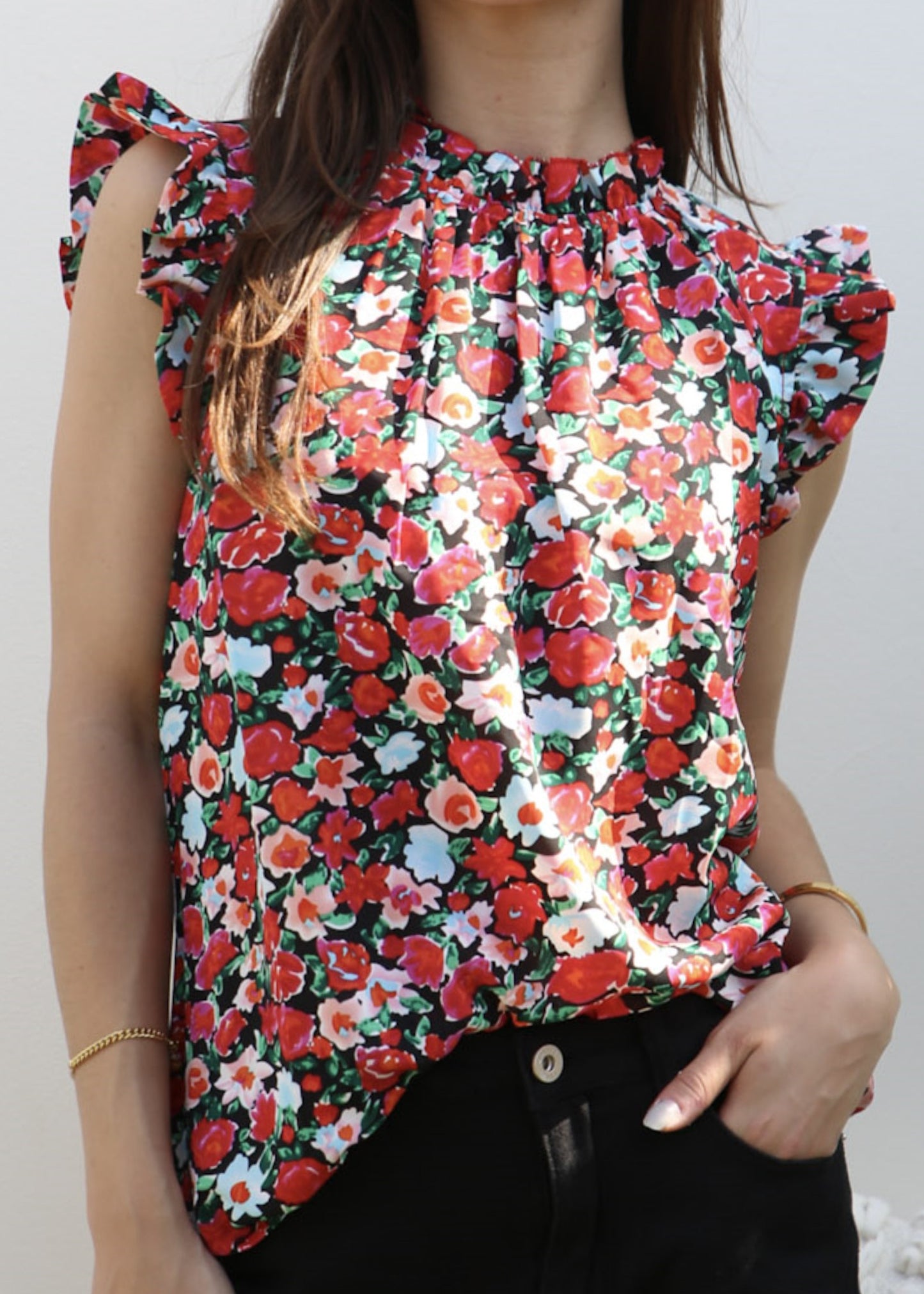 Blusa con detalle de volante y estampado floral