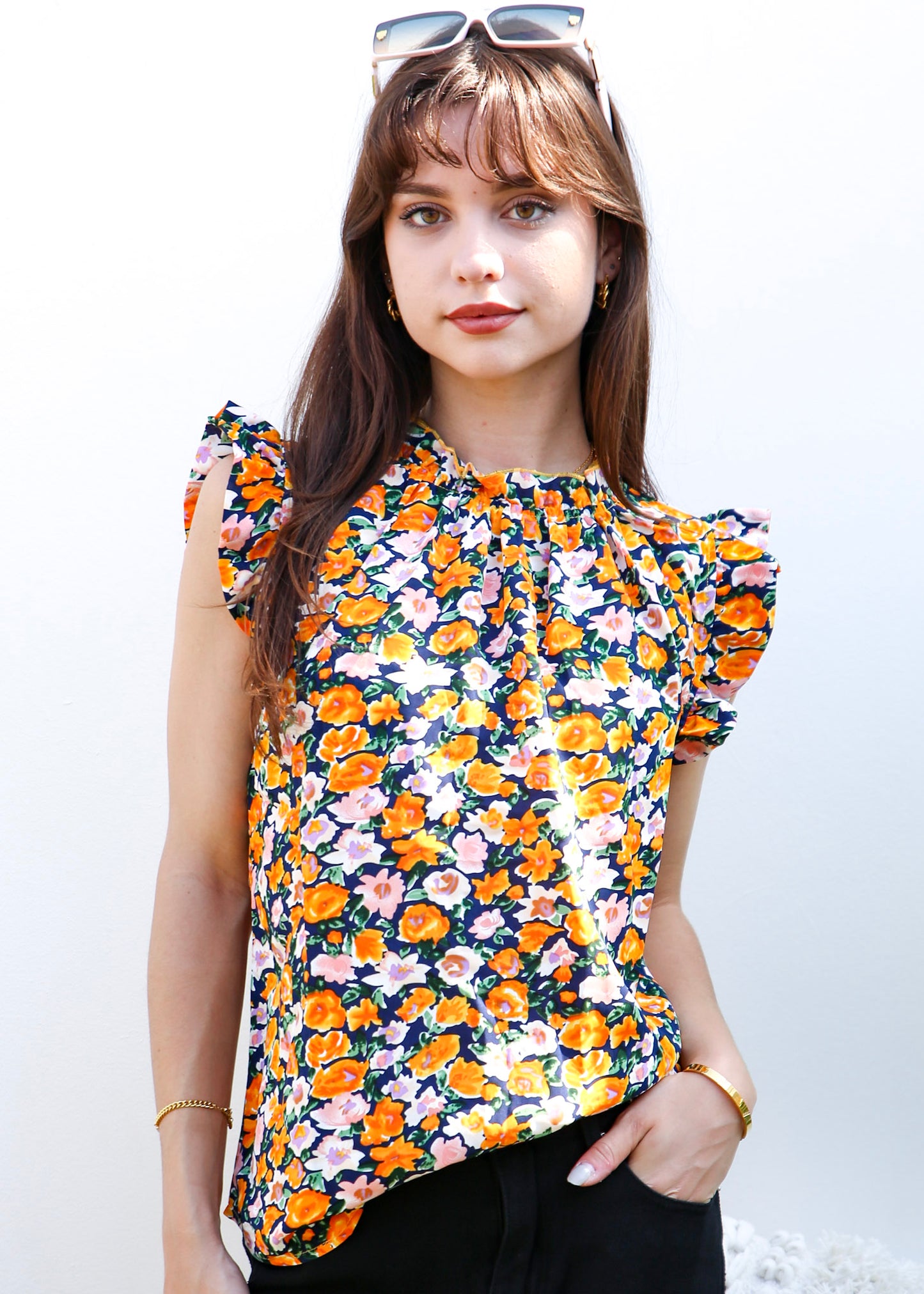 Blusa con detalle de volante y estampado floral