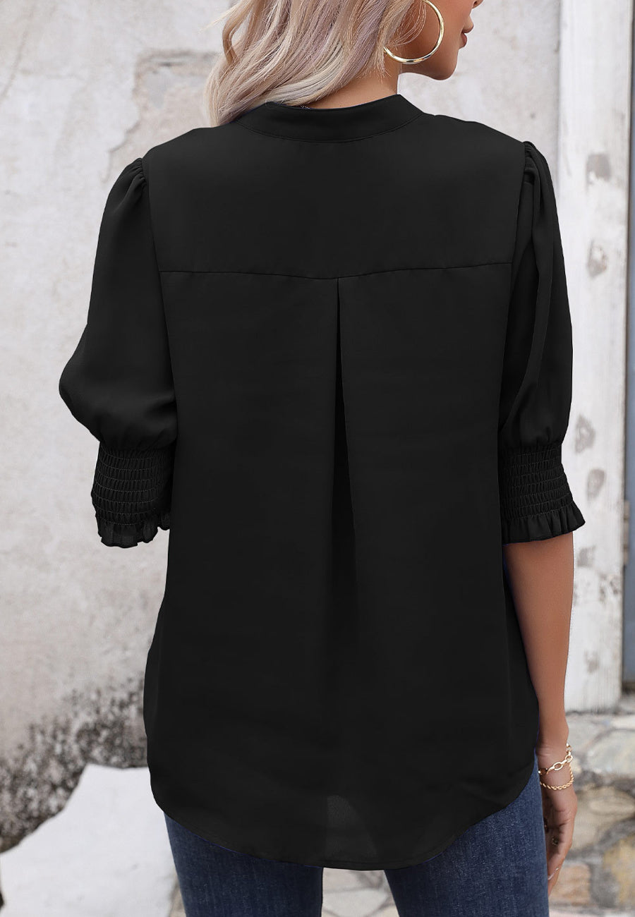 Blusa con mangas abullonadas y pliegues en la espalda