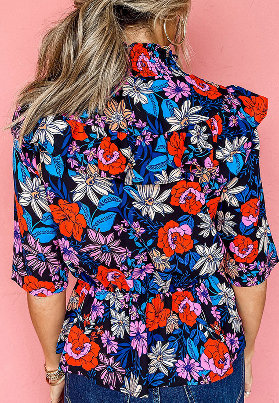 Blusa fruncida con cuello alto y volantes