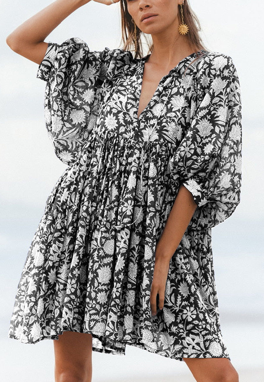 Vestido plisado con mangas dolman y estampado floral