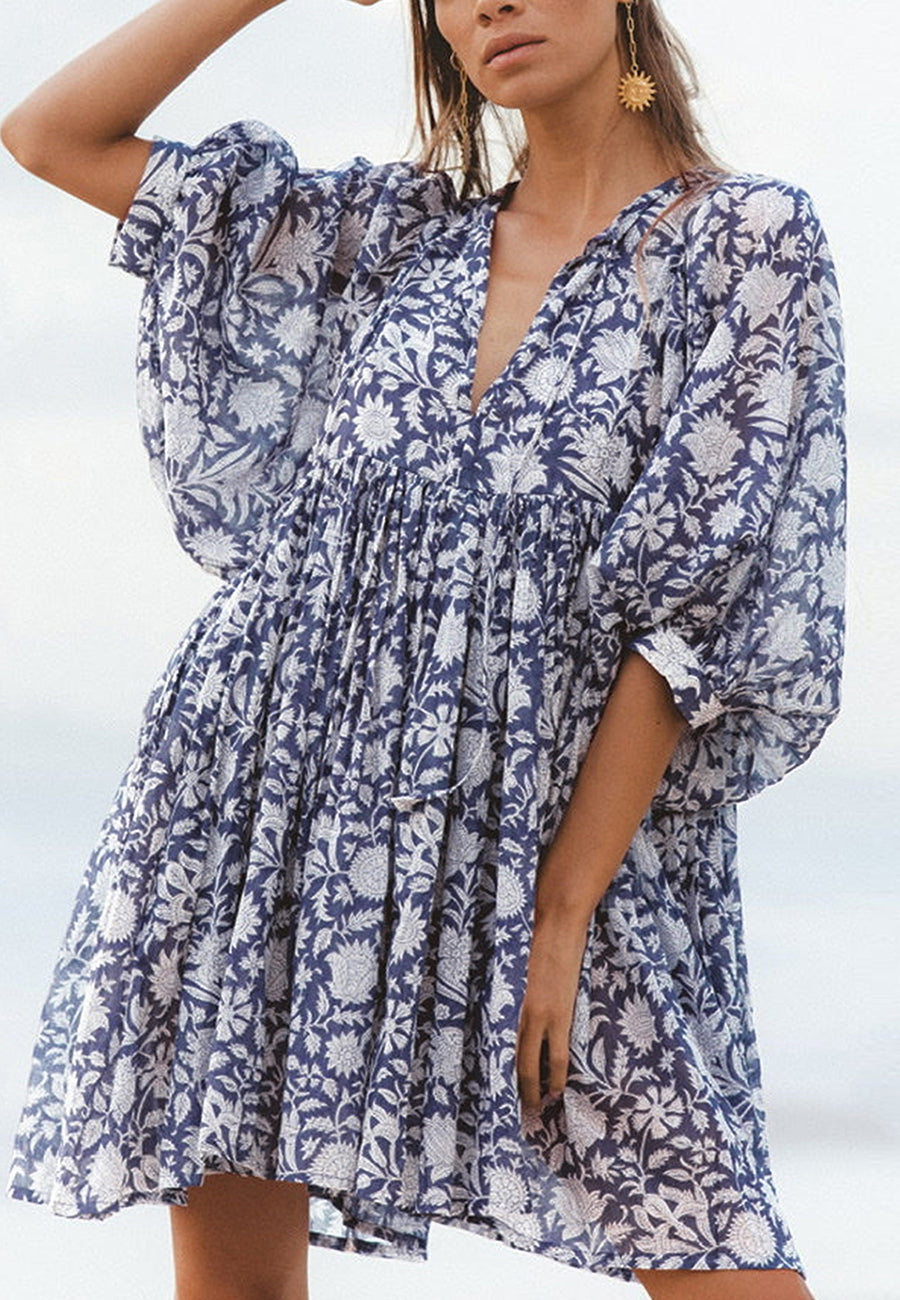Vestido plisado con mangas dolman y estampado floral