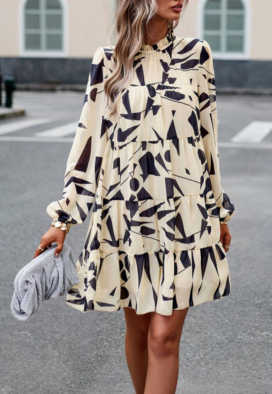 Vestido de manga larga con capas y estampado abstracto