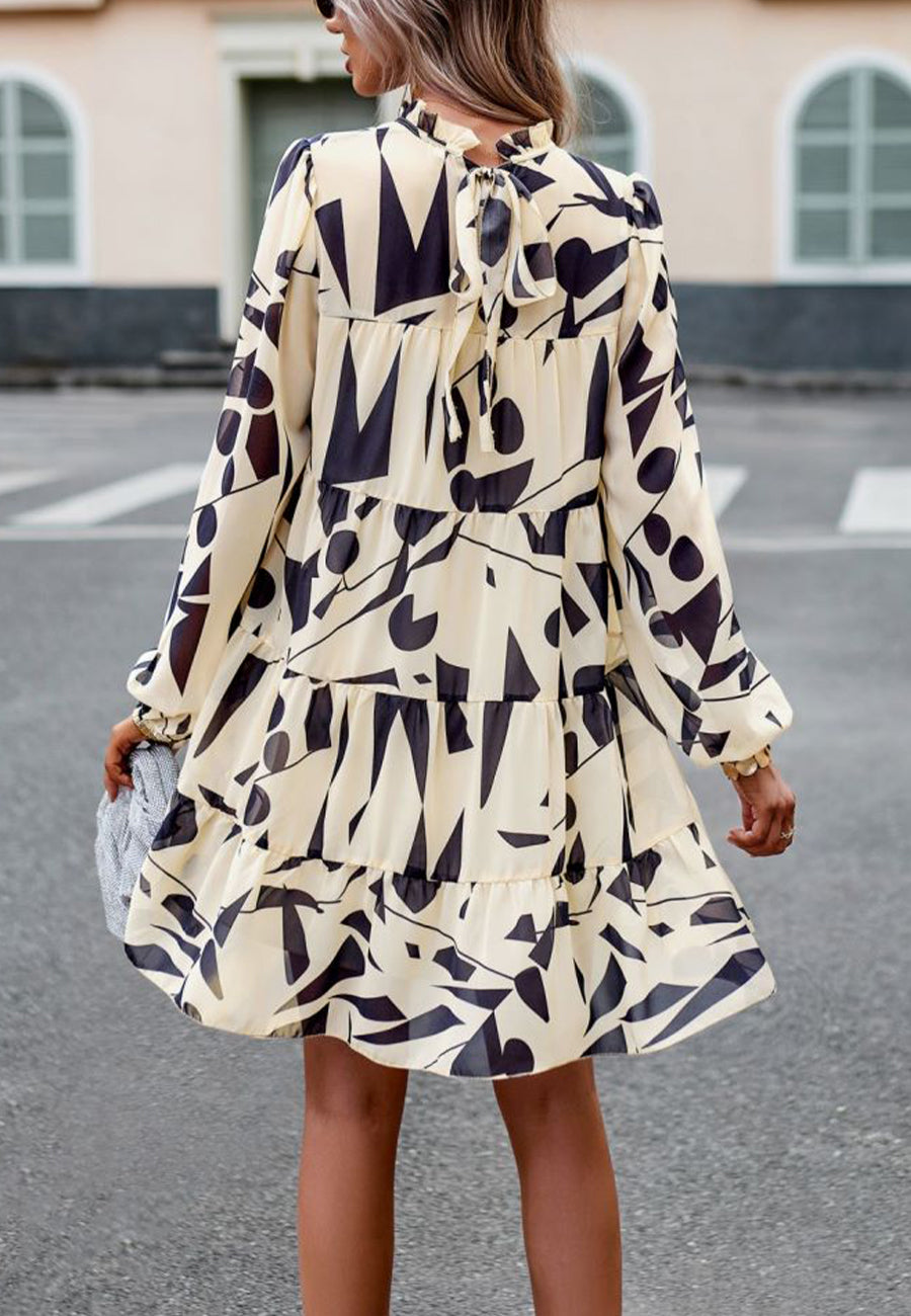 Vestido de manga larga con capas y estampado abstracto