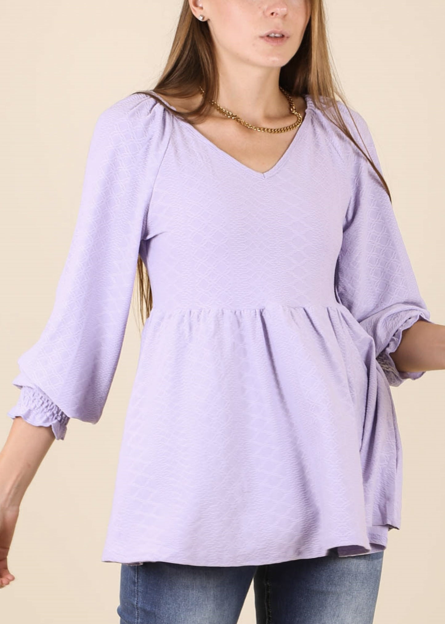 Top largo con escote en V y textura