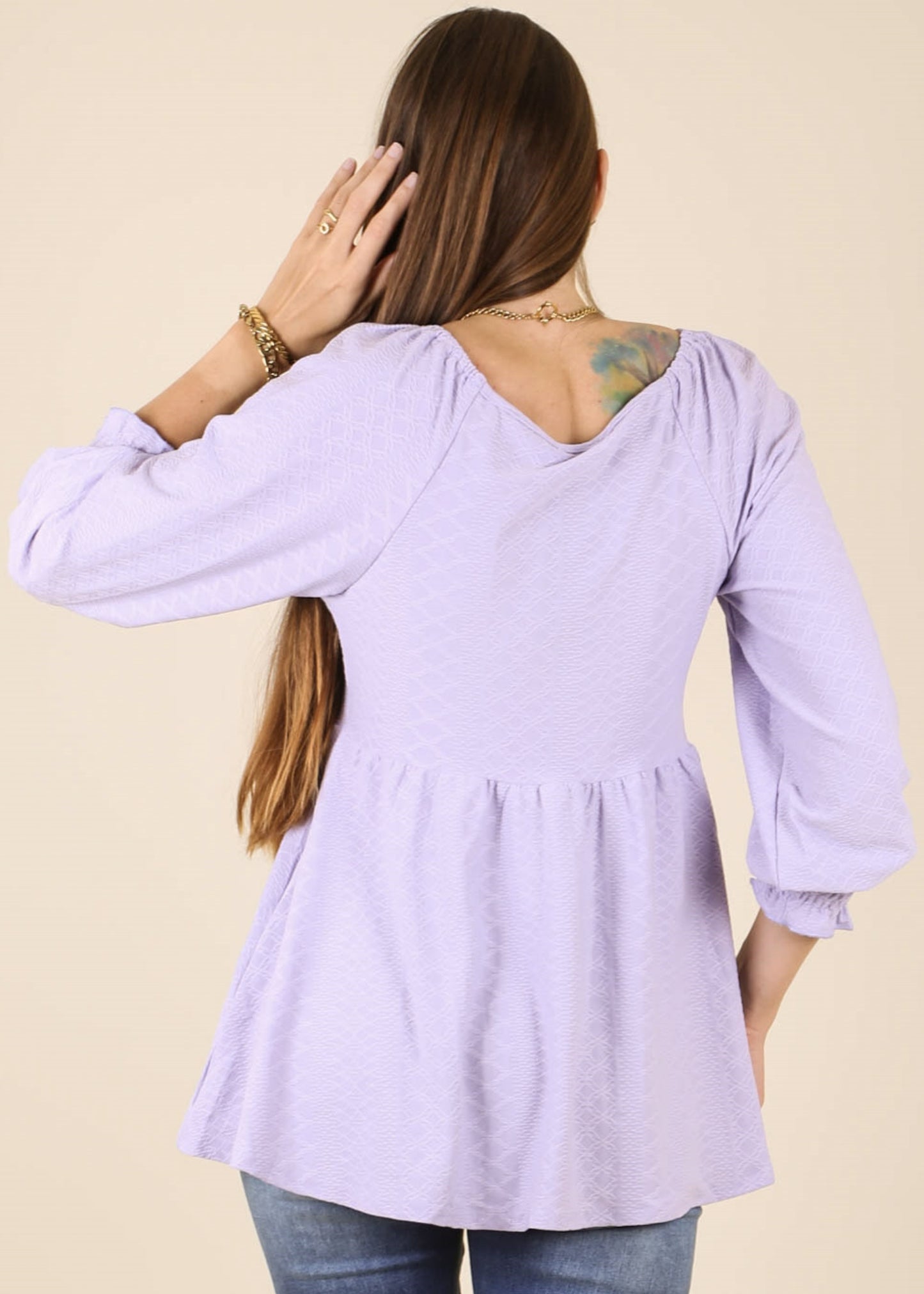 Top largo con escote en V y textura