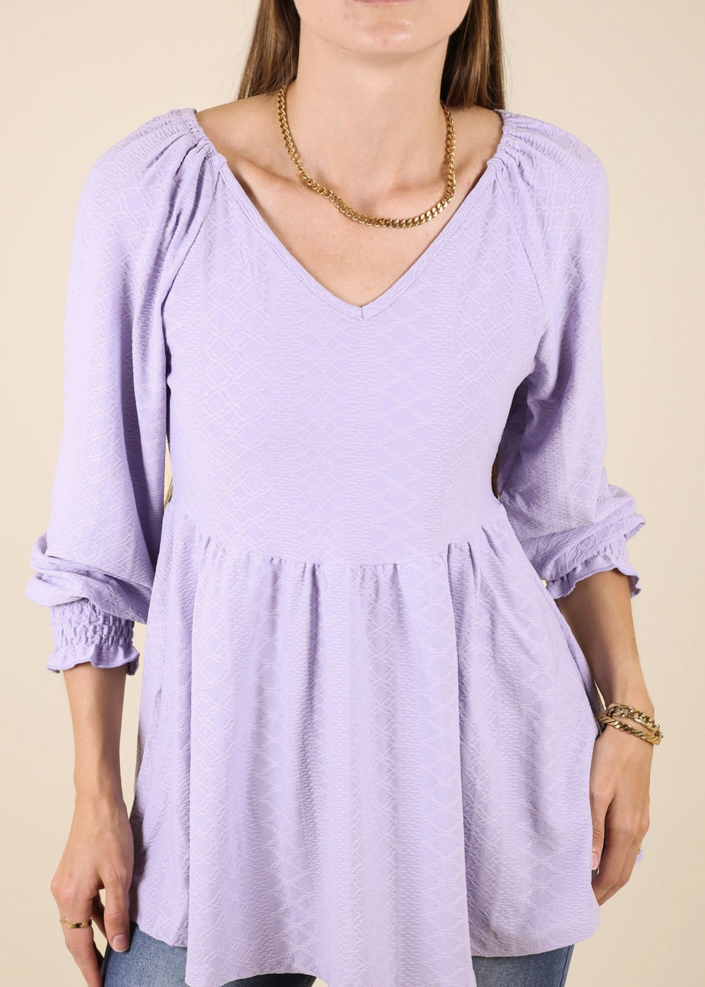 Top largo con escote en V y textura