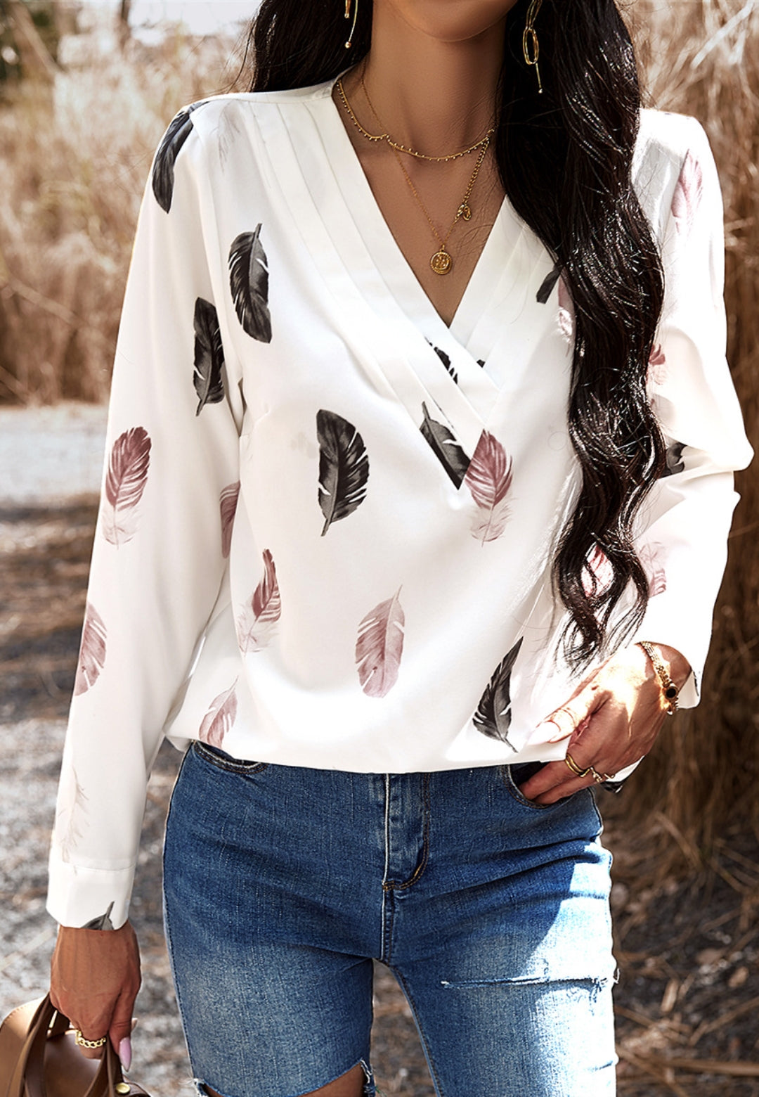 Top con estampado de plumas de color liso