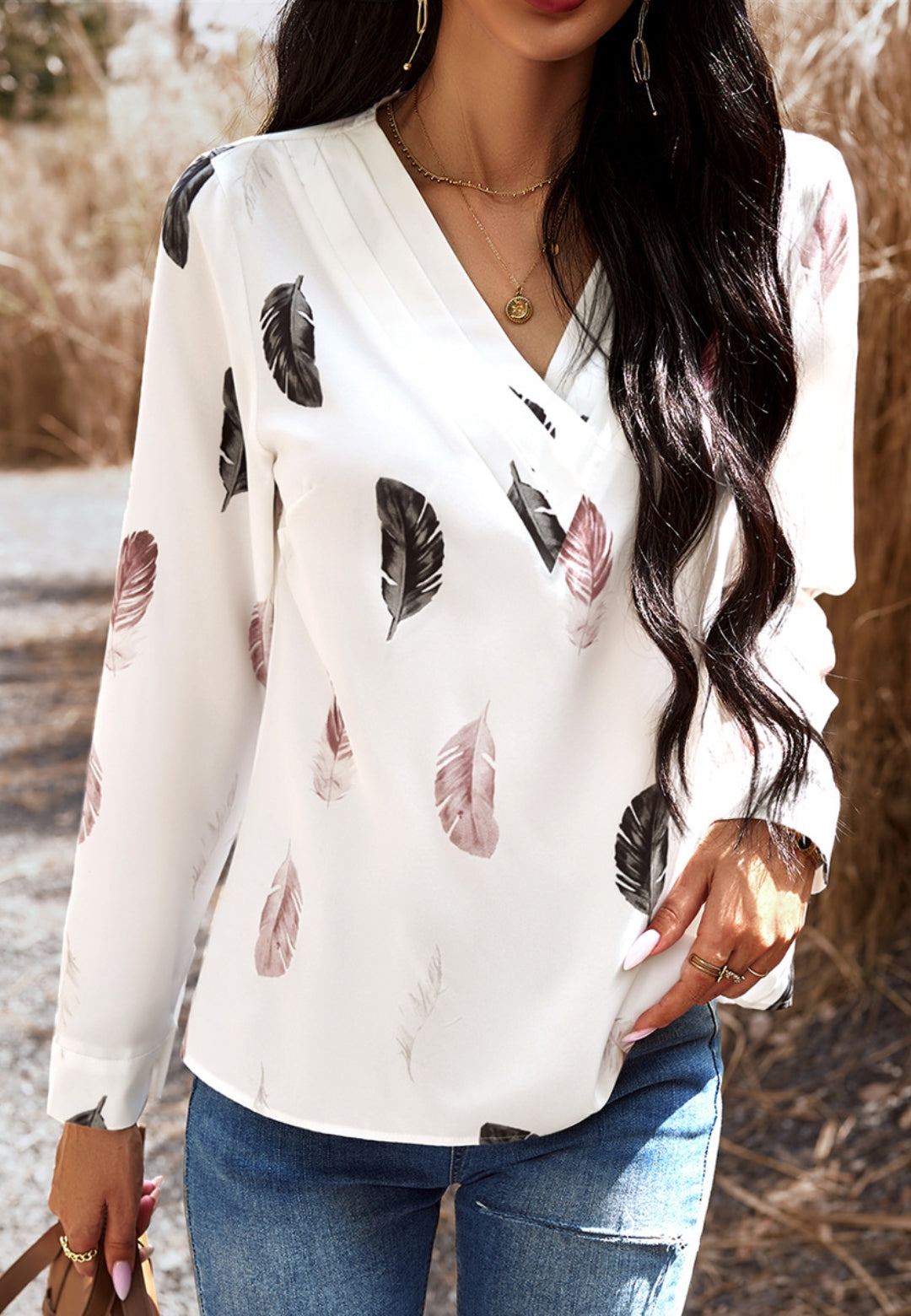 Top con estampado de plumas de color liso