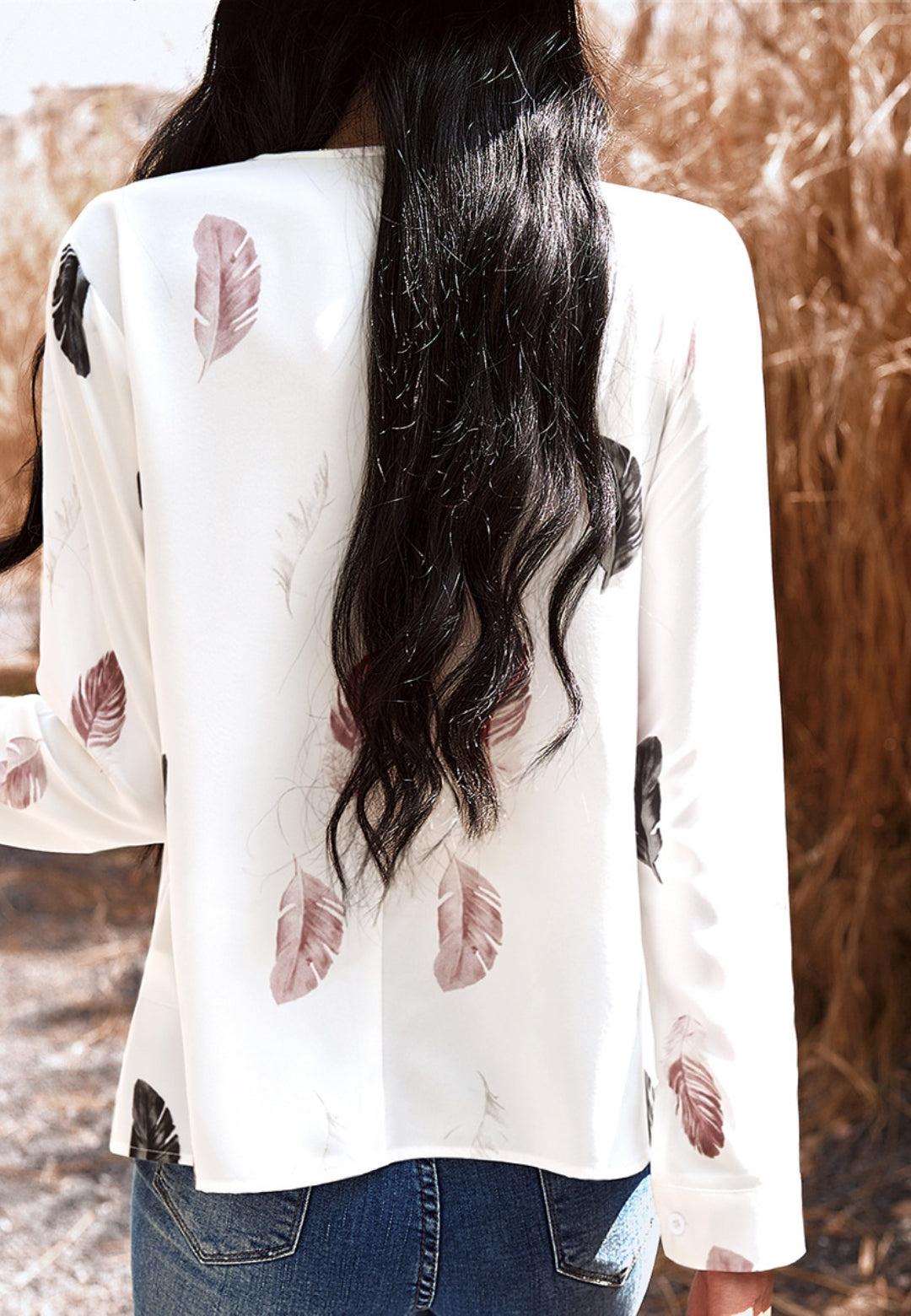 Top con estampado de plumas de color liso