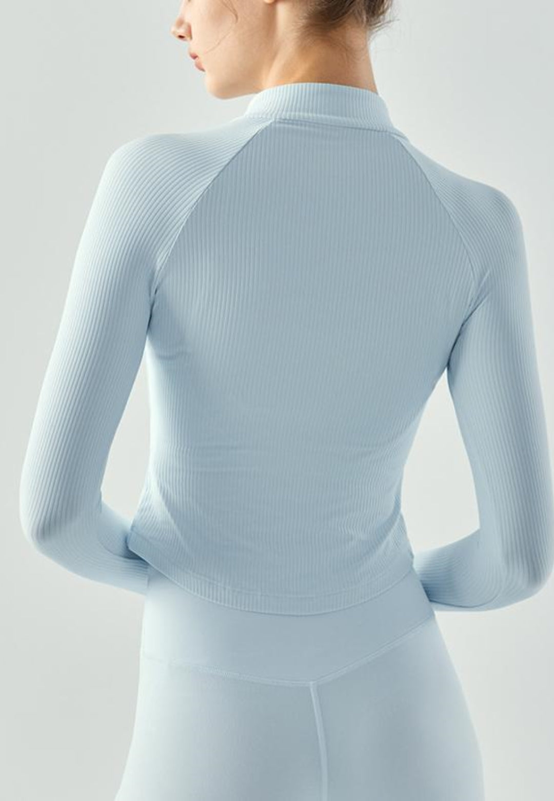 Top deportivo de punto con cremallera de un cuarto