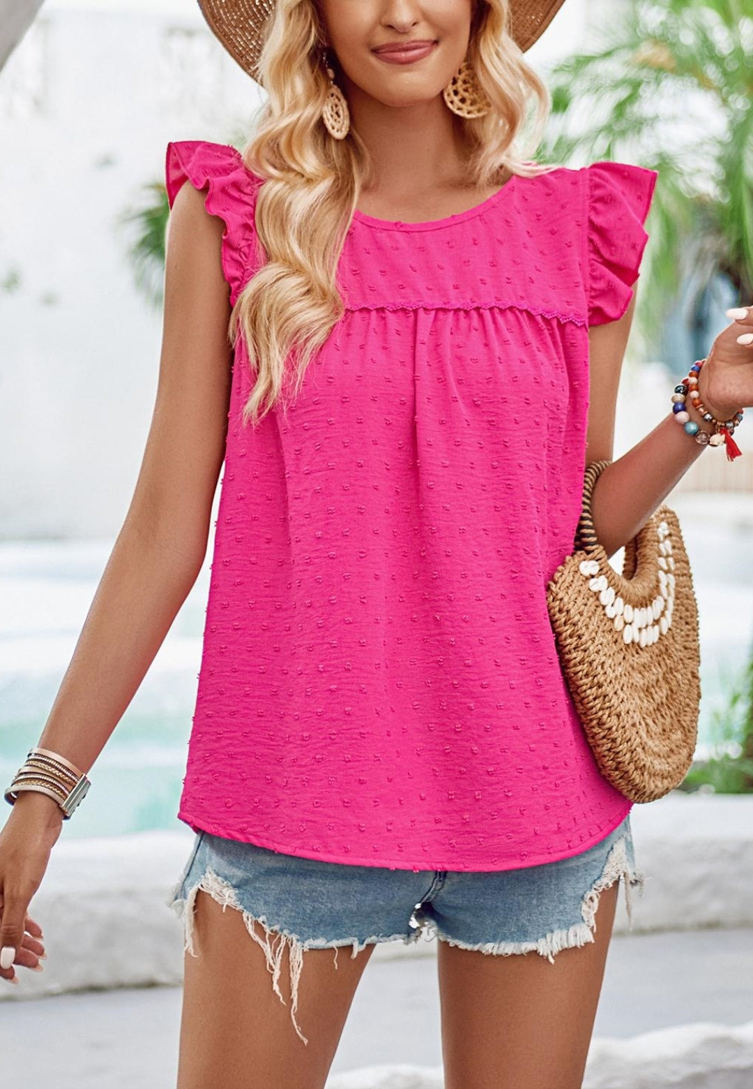 Blusa con cuello redondo y hombros con volantes