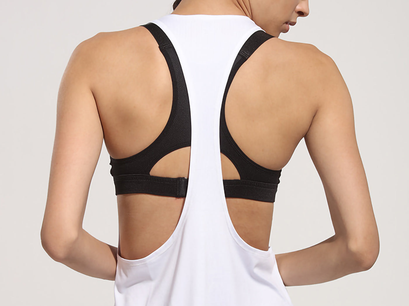 Camiseta sin mangas holgada con espalda cruzada para hacer yoga