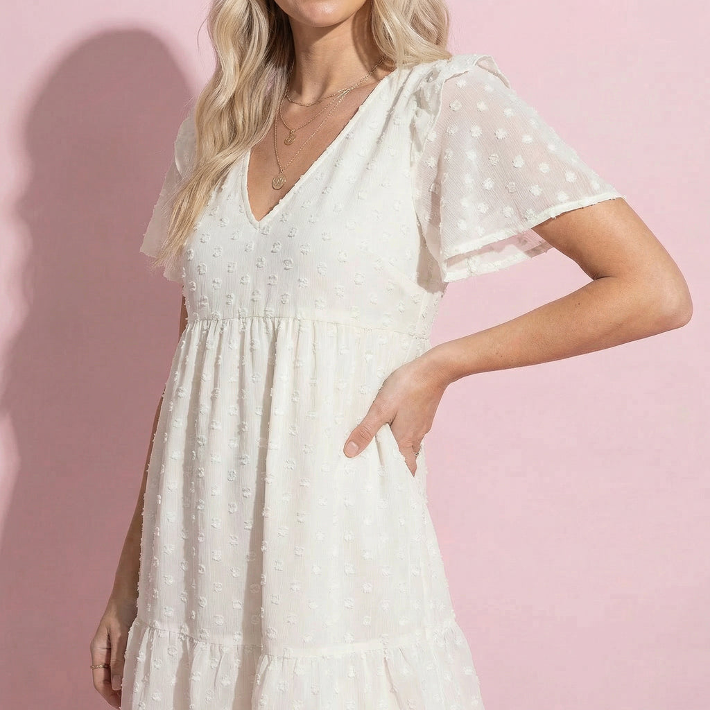 Vestido floral texturizado con hombros con volantes 