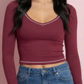 Beige women's cropped top with denim, long sleeve and v neck