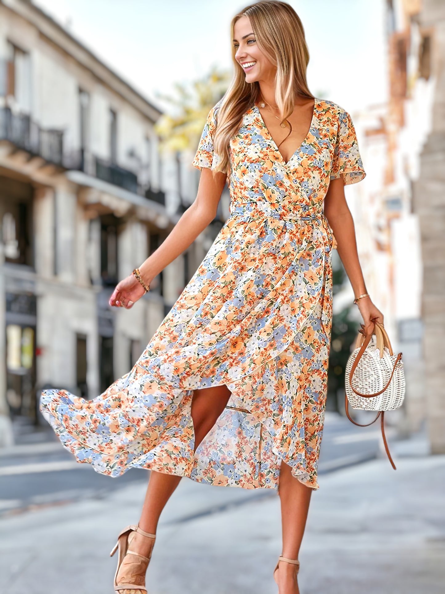 Vestido cruzado con mangas abullonadas y estampado floral 