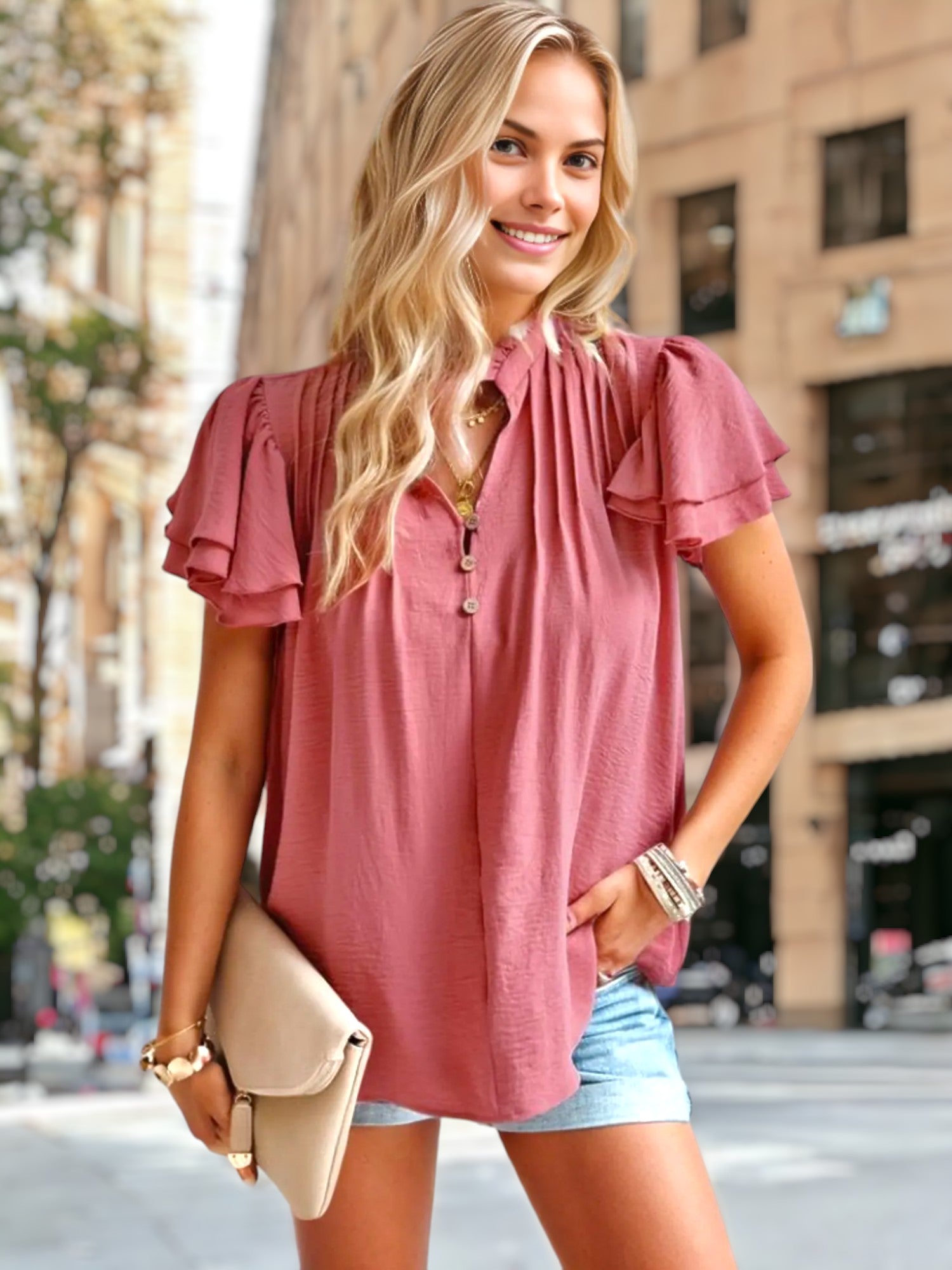 Blusa con detalle plisado y mangas abullonadas