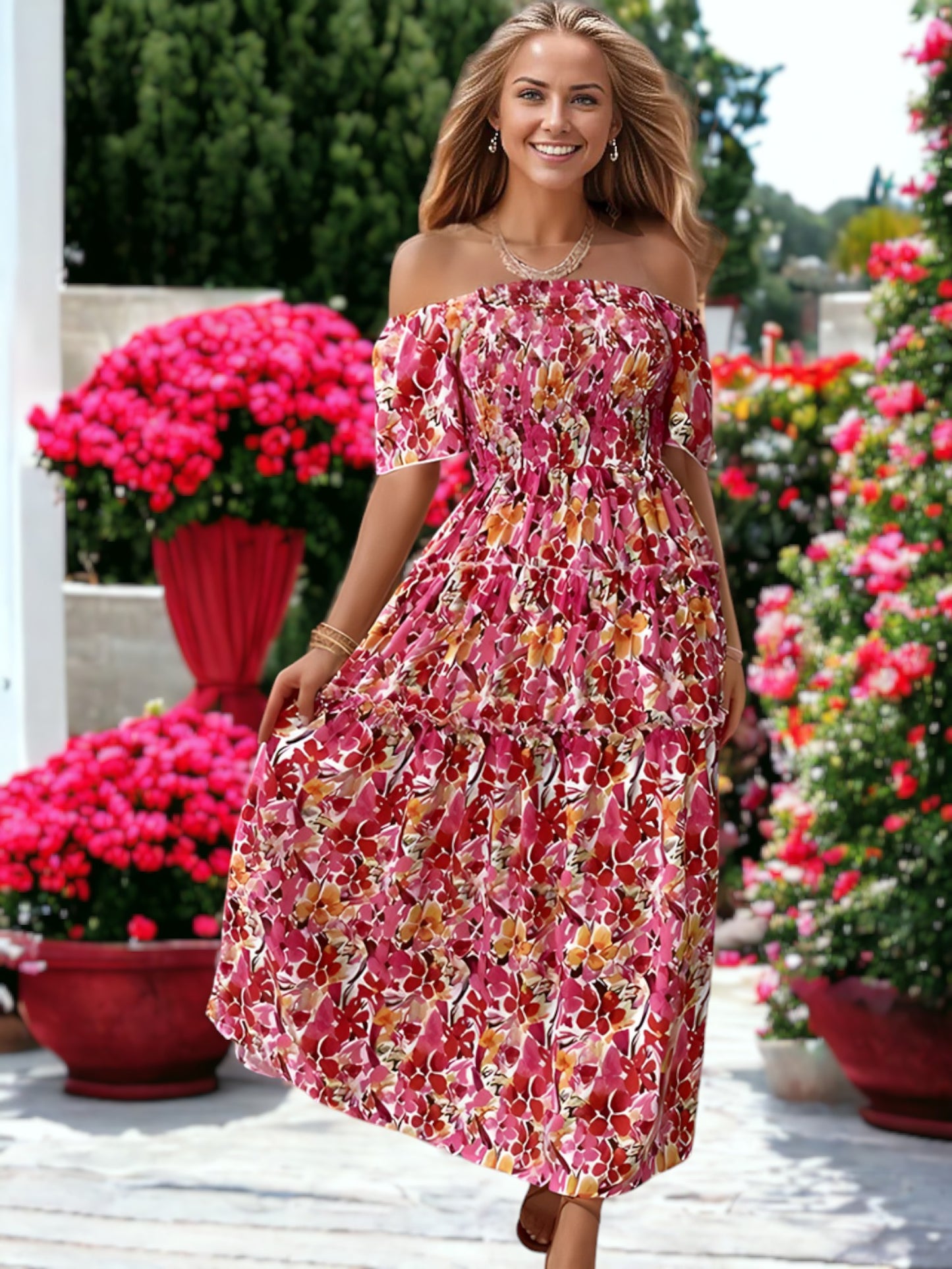 Vestido largo con volantes y hombros descubiertos con estampado floral