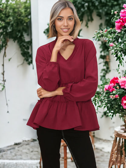 Blusa con cuello mandarín y dobladillo con volantes