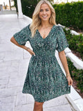 Minivestido con mangas abullonadas, espalda cruzada y tirantes con estampado de serpiente