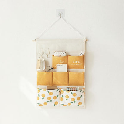 Anna-Kaci Hanging Wall Storage Organizer with Multiple Fabric Pockets and Orange Fruit Print Design