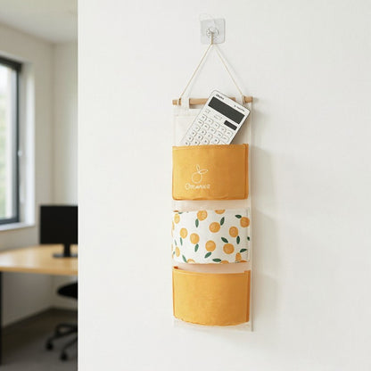Anna-Kaci Hanging Wall Storage Organizer with Multiple Fabric Pockets and Orange Fruit Print Design