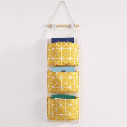 Anna-Kaci Hanging Wall Organizer with Three Fabric Pockets and Wooden Rod Design
