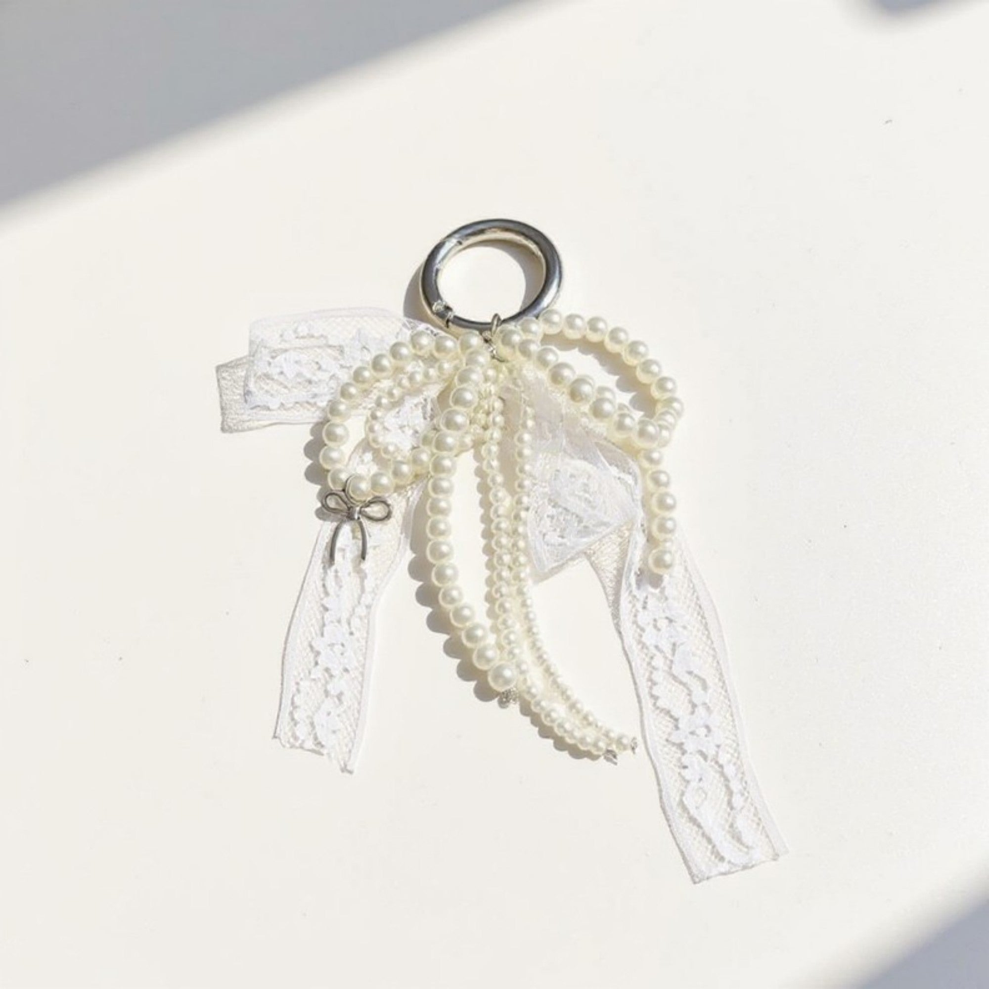 Anna-Kaci Pearl and Lace Bow Keychain with Silver Ring and Charm Accent
