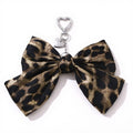 Anna-Kaci Leopard Print Fabric Bow Keychain with Silver Heart Clip Charm
