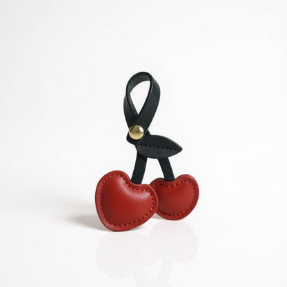 Anna-Kaci Faux Leather Cherry Heart Keychain with Black Leaf Strap and Gold Rivet Detail