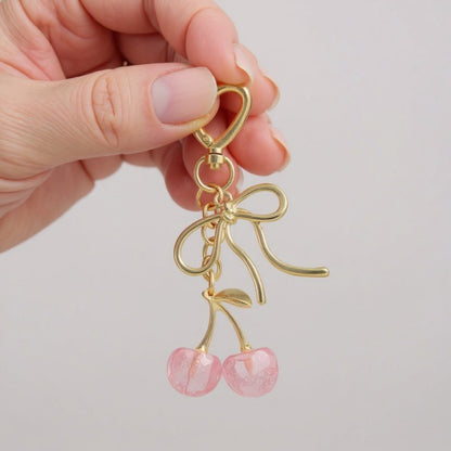 Anna-Kaci Gold Bow Keychain with Pink Cherry Charms and Heart Clasp