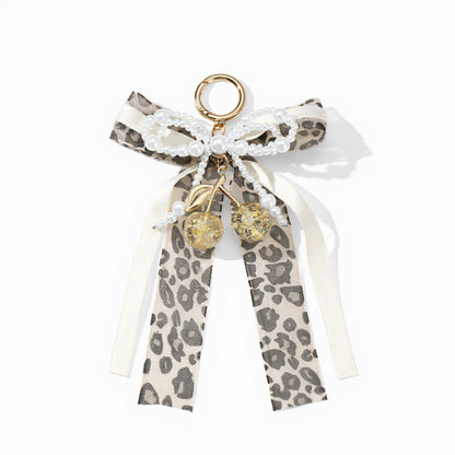 Anna-Kaci Leopard Print Ribbon Keychain with Pearl Bow and Cherry Charms