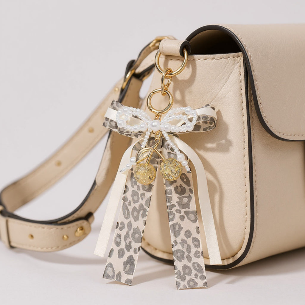 Anna-Kaci Leopard Print Ribbon Keychain with Pearl Bow and Cherry Charms