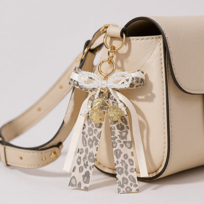 Anna-Kaci Leopard Print Ribbon Keychain with Pearl Bow and Cherry Charms