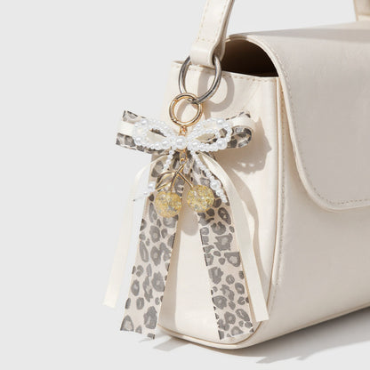 Anna-Kaci Leopard Print Ribbon Keychain with Pearl Bow and Cherry Charms