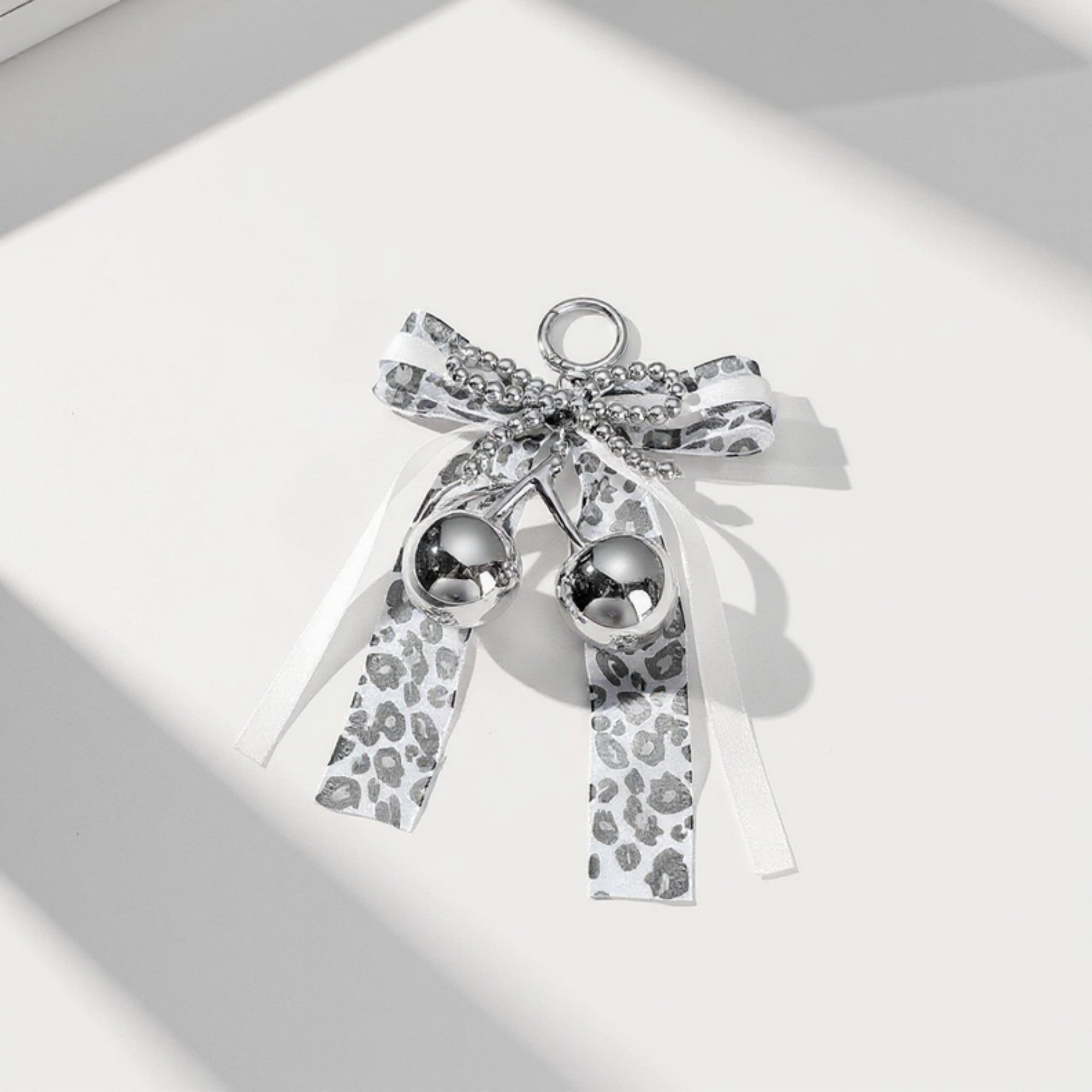 Anna-Kaci Leopard Print Ribbon Keychain with Pearl Bow and Cherry Charms