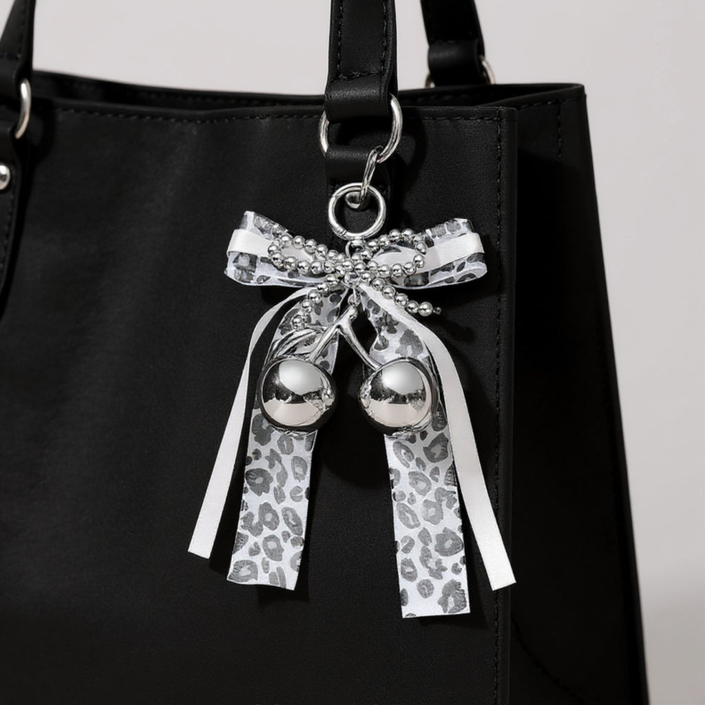 Anna-Kaci Leopard Print Ribbon Keychain with Pearl Bow and Cherry Charms