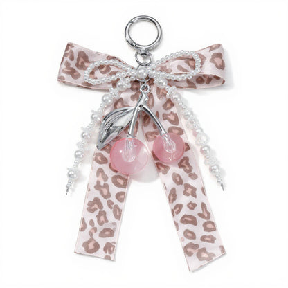 Anna-Kaci Leopard Print Ribbon Keychain with Pearl Bow and Cherry Charms