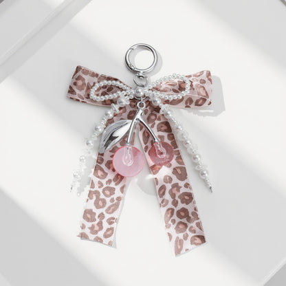 Anna-Kaci Leopard Print Ribbon Keychain with Pearl Bow and Cherry Charms