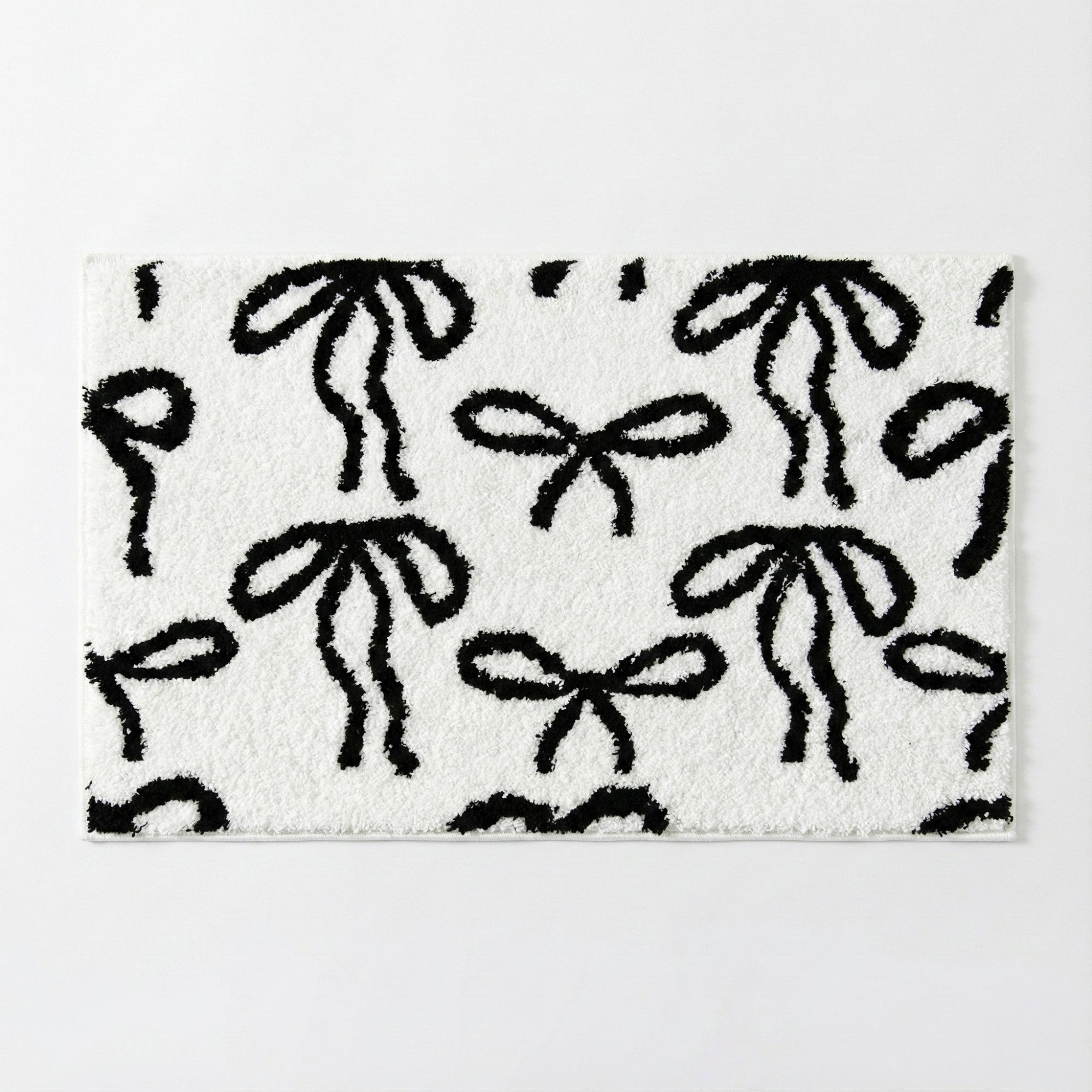 Anna-Kaci Tufted Abstract Bow Accent Mat Decorative Floor and Tabletop Decoration