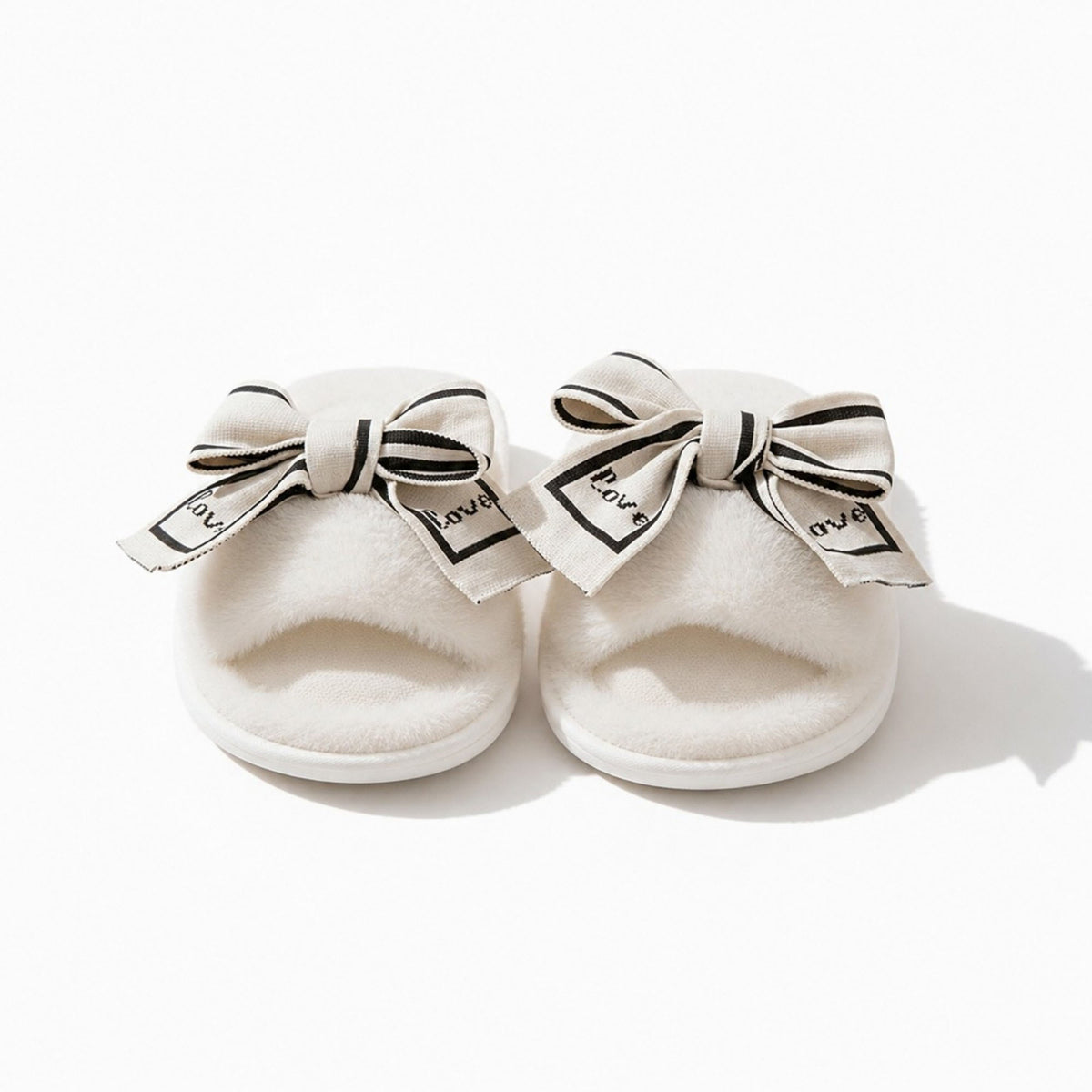 Pantuflas de peluche tipo sandalia para mujer Anna-Kaci con lazo y detalle gráfico
