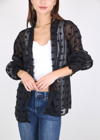 Cárdigan con mangas de obispo y puntos con clip