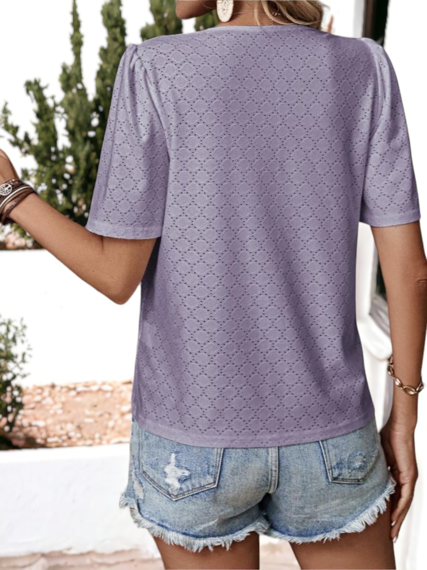 Blusa holgada transpirable con escote en V y ojales con botones