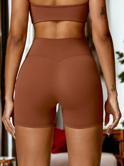 Pantalones cortos ajustados de fitness para mujer que realzan los glúteos