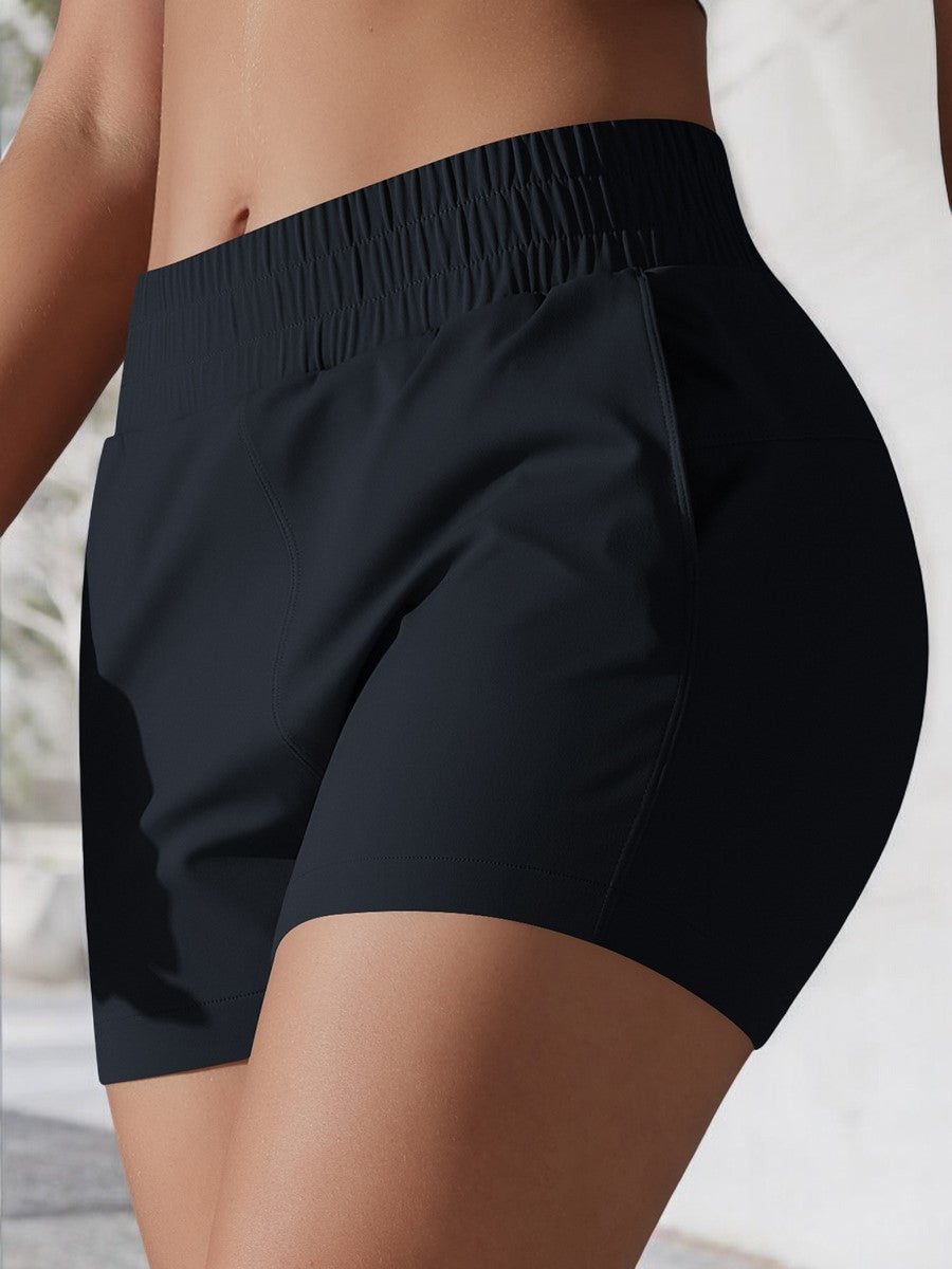 Pantalones cortos deportivos de cintura alta para mujer de Anna-Kaci con cinturilla elástica y bolsillos laterales