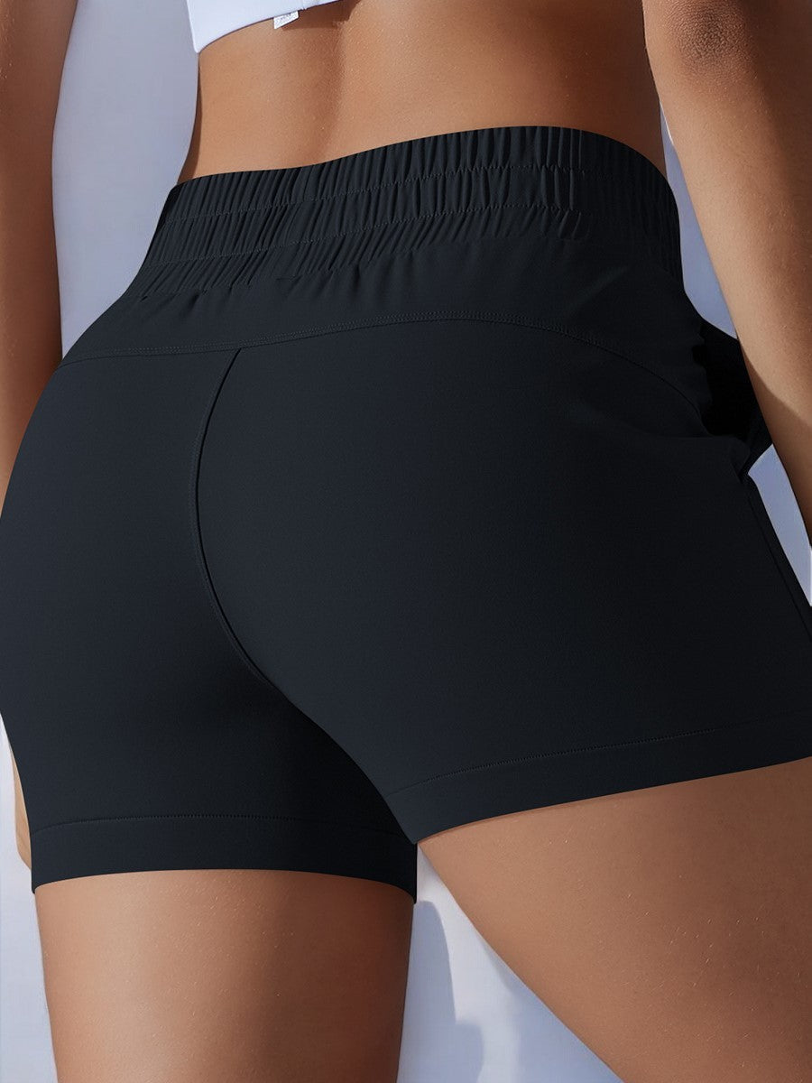 Pantalones cortos deportivos de cintura alta para mujer de Anna-Kaci con cinturilla elástica y bolsillos laterales