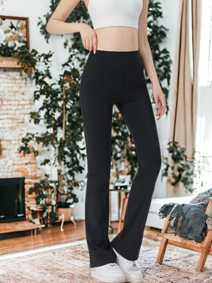 Pantalones de entrenamiento fitness con bolsillos y microacampanados