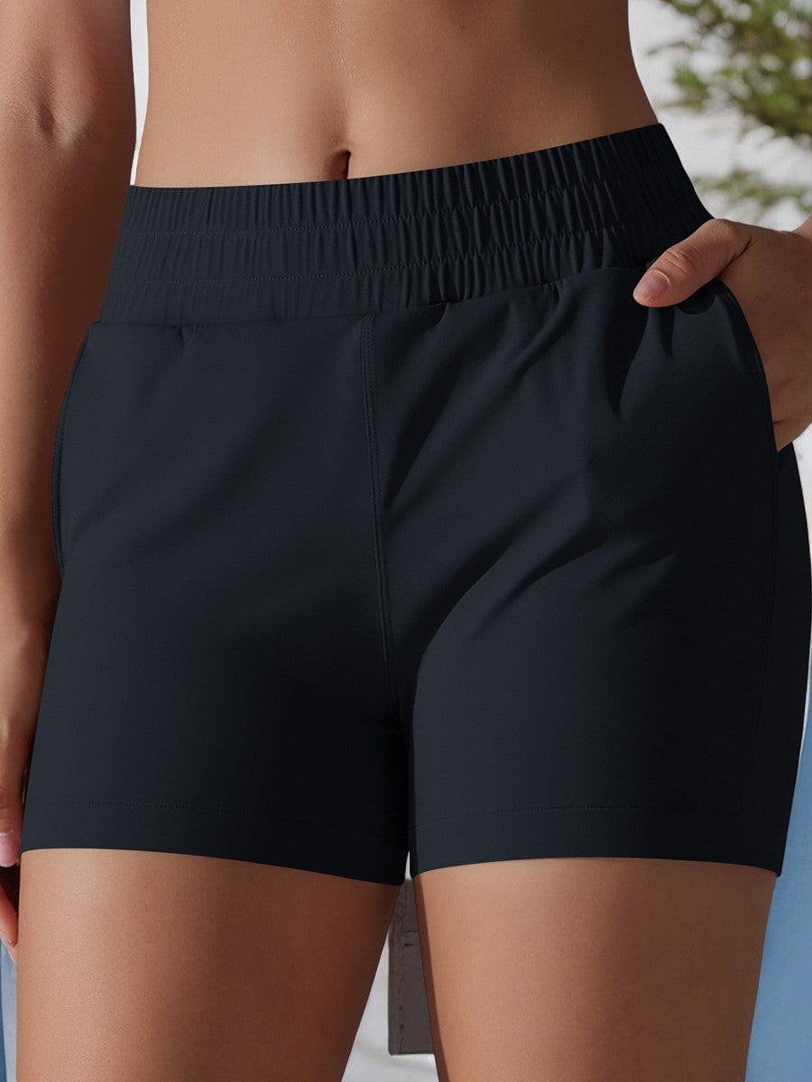 Pantalones cortos deportivos de cintura alta para mujer de Anna-Kaci con cinturilla elástica y bolsillos laterales