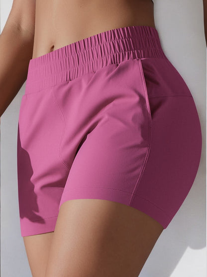 Pantalones cortos deportivos de cintura alta para mujer de Anna-Kaci con cinturilla elástica y bolsillos laterales