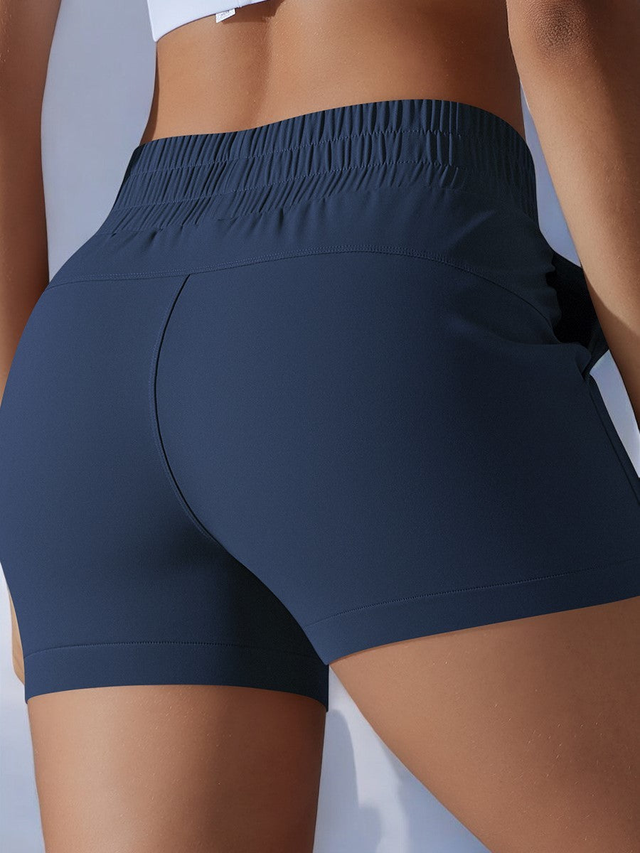 Pantalones cortos deportivos de cintura alta para mujer de Anna-Kaci con cinturilla elástica y bolsillos laterales